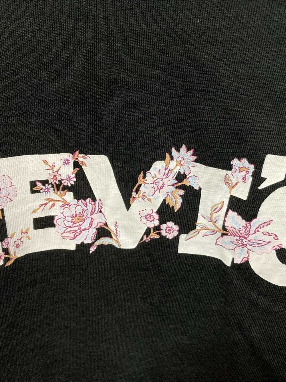 Levi's Black Tee with White Logo and Pink Floral Accent